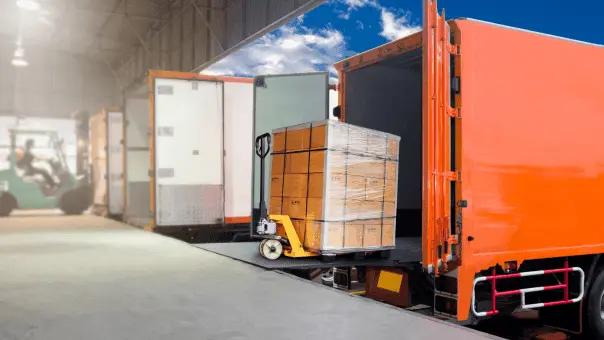 Forklift loading pallets into truck