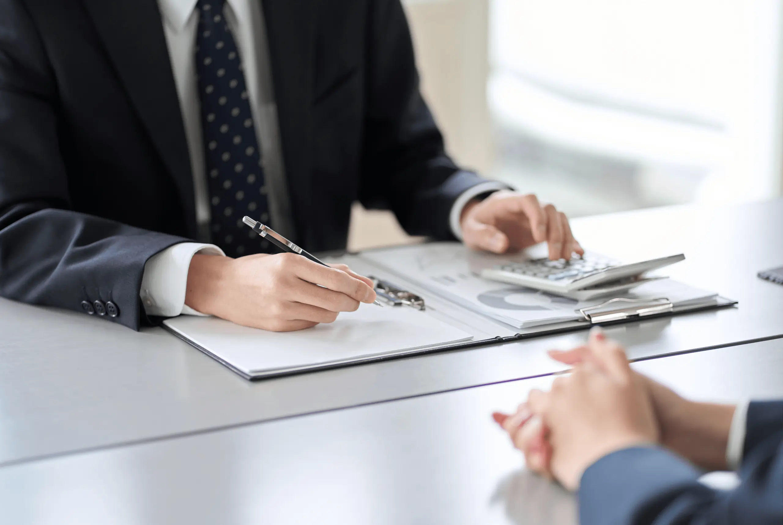 Businessman reviewing documents at desk