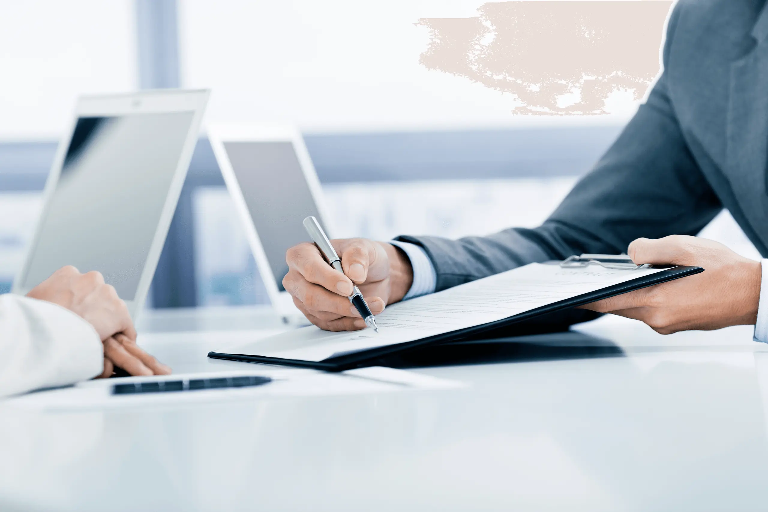 Business person signing documents