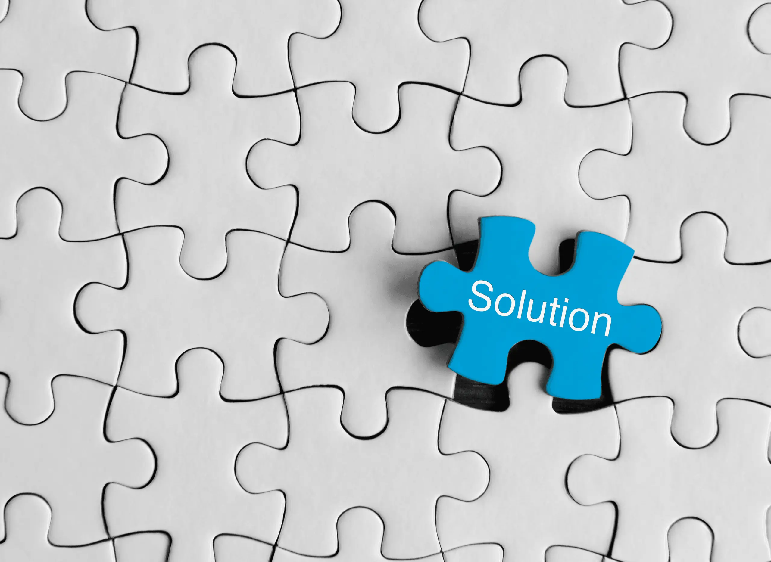 Gray puzzle with blue 'Solution' piece